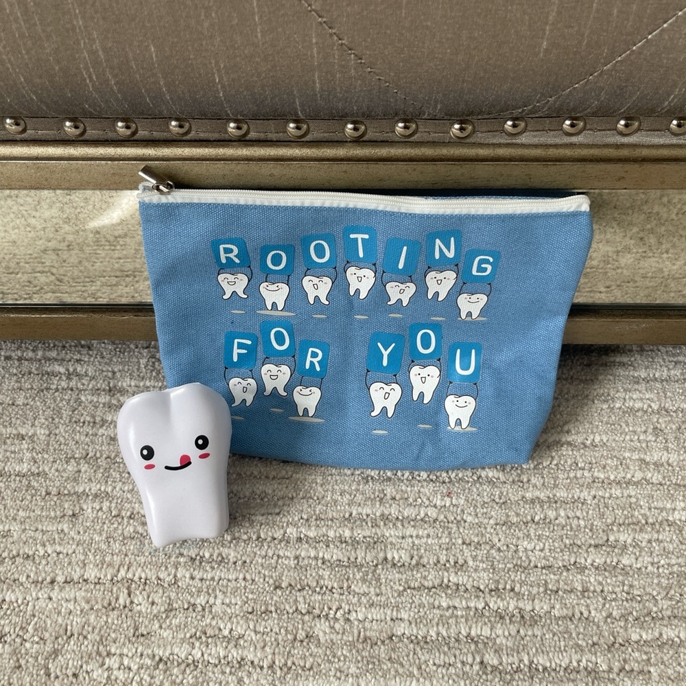 Blue Tooth-Themed Pouch with Cute Tooth Figurine